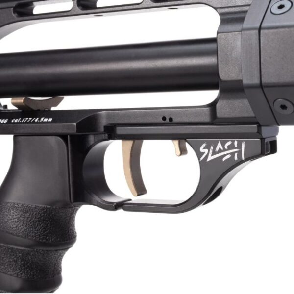 Close-up of a black airgun with curved trigger guard and white graphic text "SLAC" on the grip.